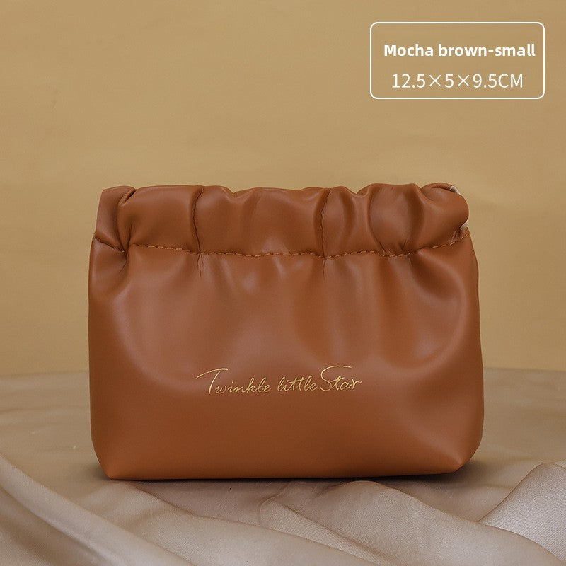 Portable hand-held zoned makeup bag
