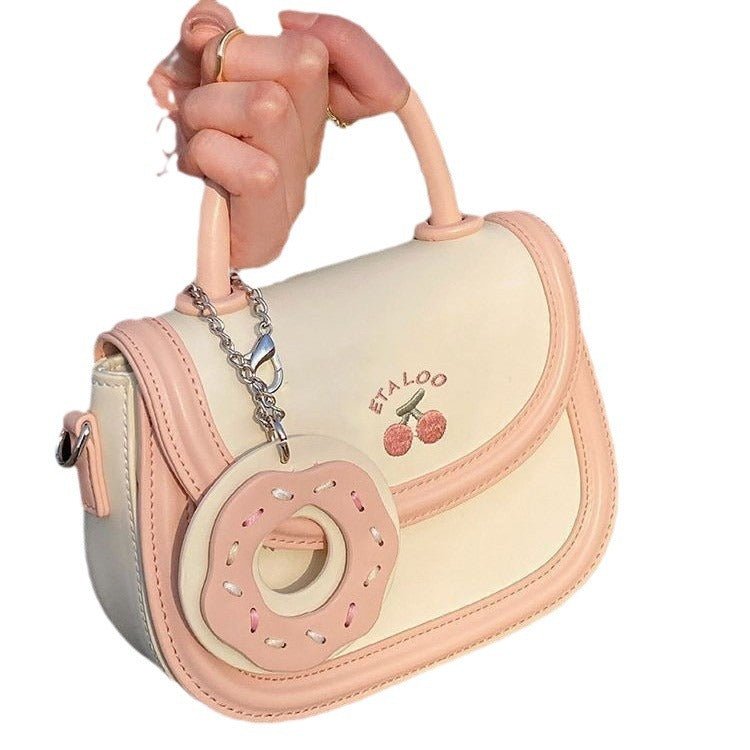 Hand-held shoulder saddle bag
