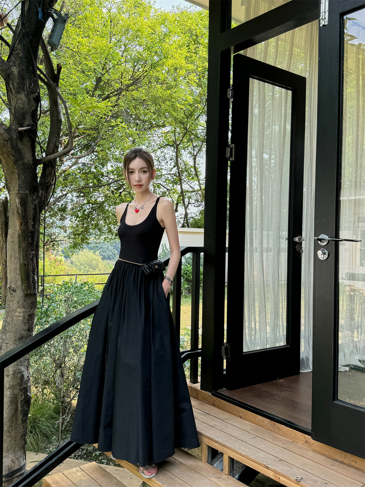 Black vest dress with floor-length skirt