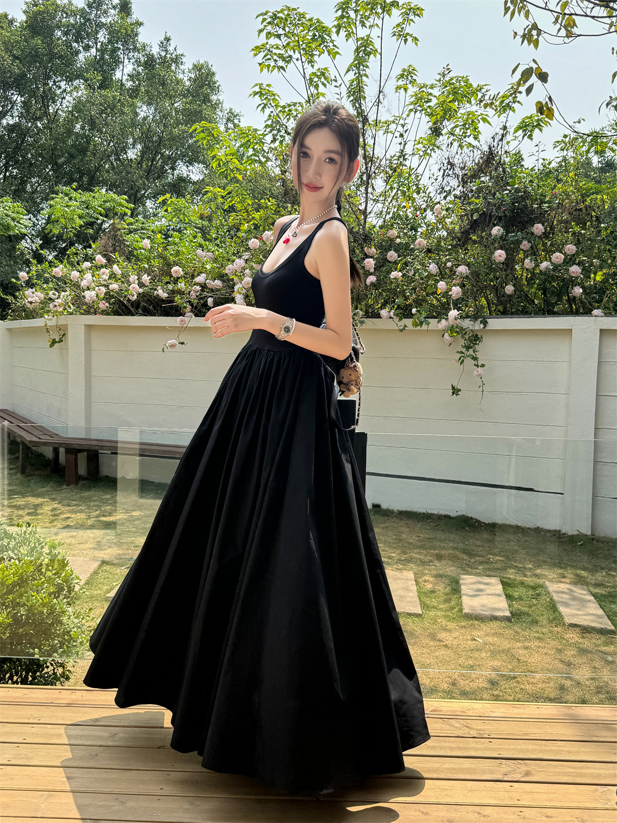 Black vest dress with floor-length skirt
