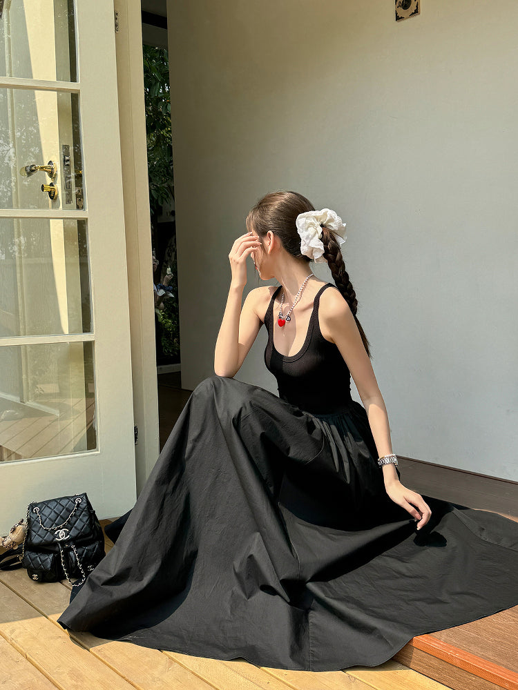 Black vest dress with floor-length skirt