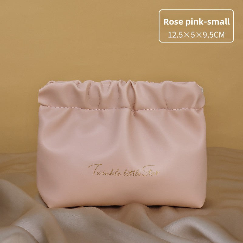 Portable hand-held zoned makeup bag