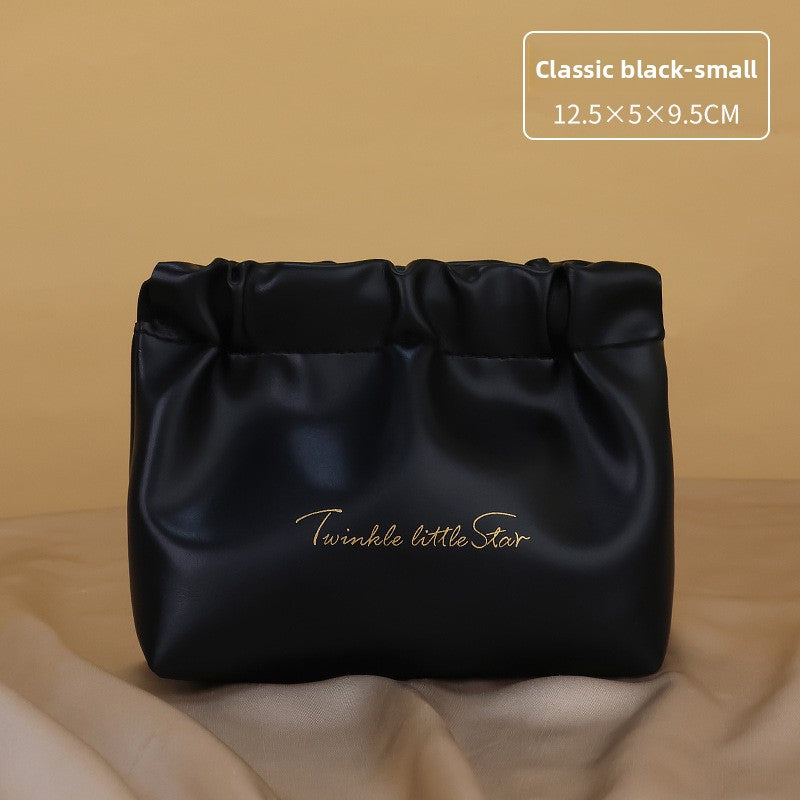 Portable hand-held zoned makeup bag