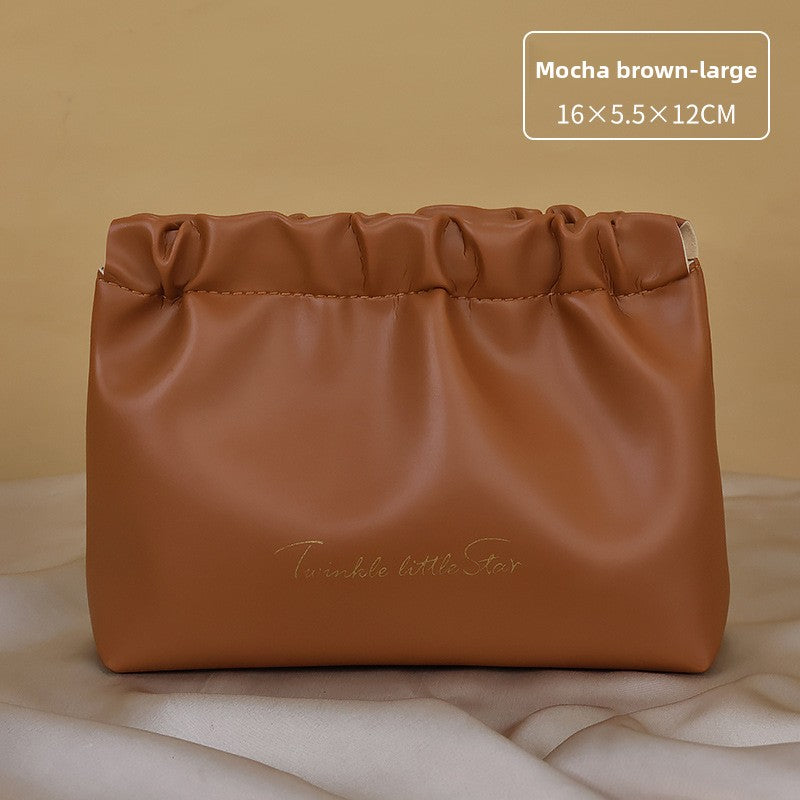 Portable hand-held zoned makeup bag