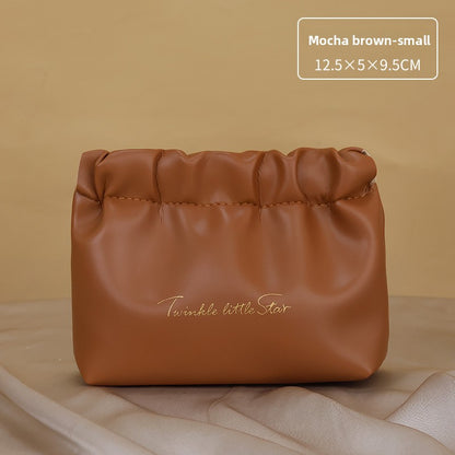 Portable hand-held zoned makeup bag