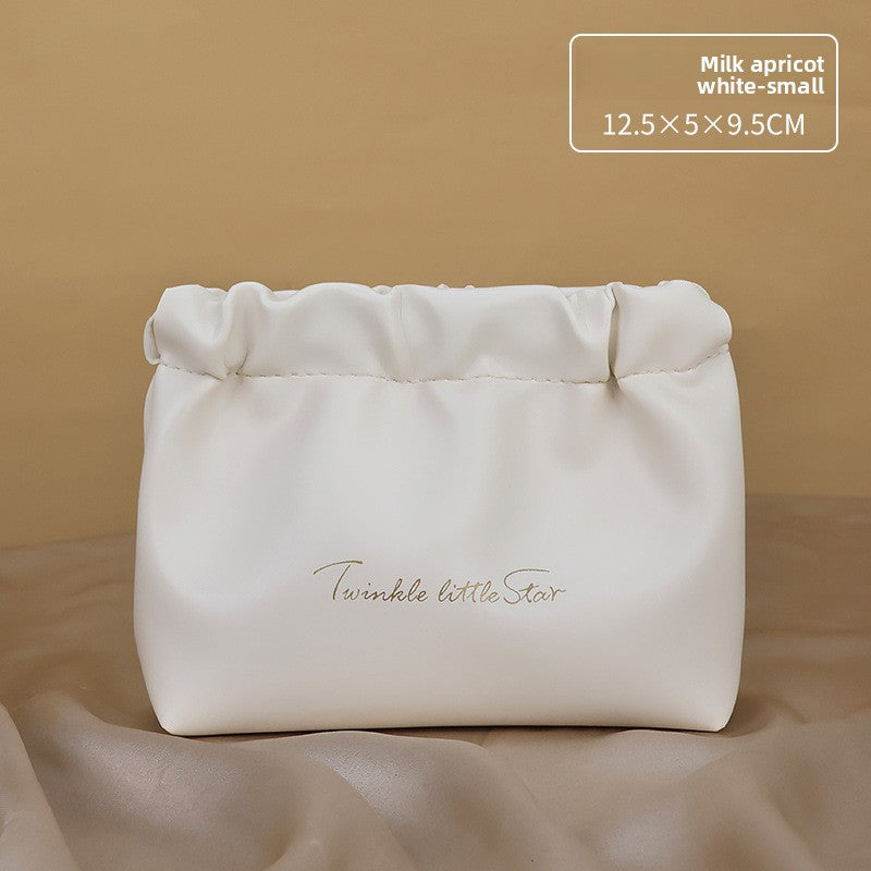 Portable hand-held zoned makeup bag