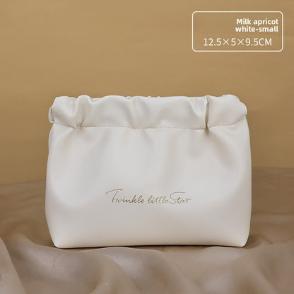 Portable hand-held zoned makeup bag