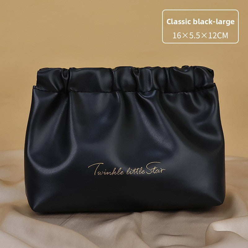 Portable hand-held zoned makeup bag
