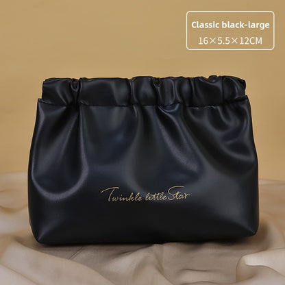 Portable hand-held zoned makeup bag