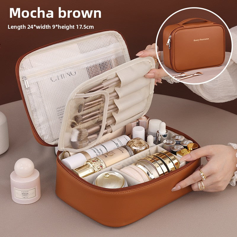 Portable hand-held zoned makeup bag