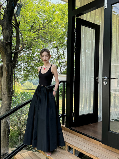 Black vest dress with floor-length skirt