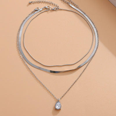 Layered Lotus Pendant Necklace with Geometric Blade Chain