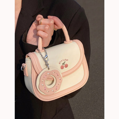 Hand-held shoulder saddle bag
