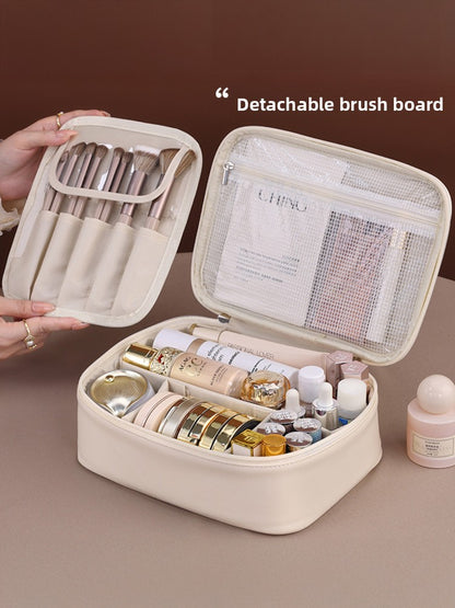 Portable hand-held zoned makeup bag