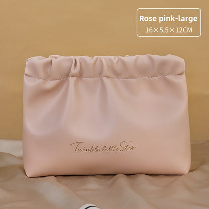 Portable hand-held zoned makeup bag