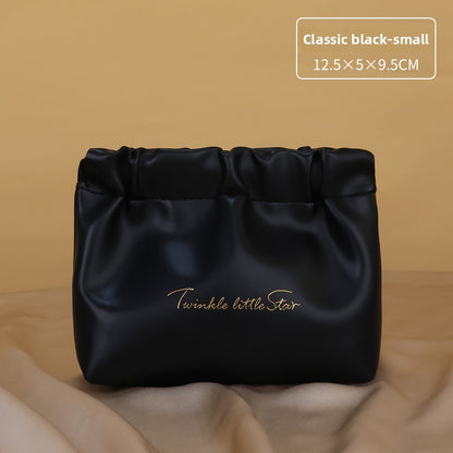 Portable hand-held zoned makeup bag