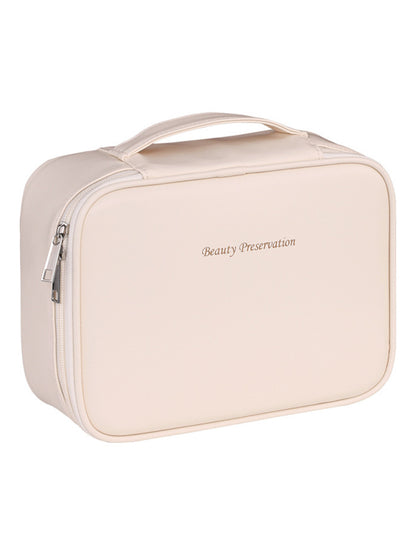 Portable hand-held zoned makeup bag