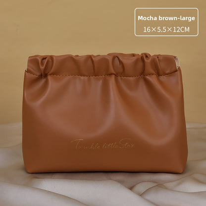 Portable hand-held zoned makeup bag