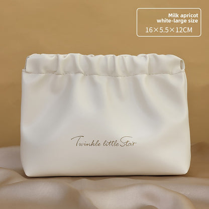 Portable hand-held zoned makeup bag