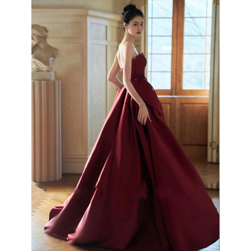 Evening dress in wine red strapless satin