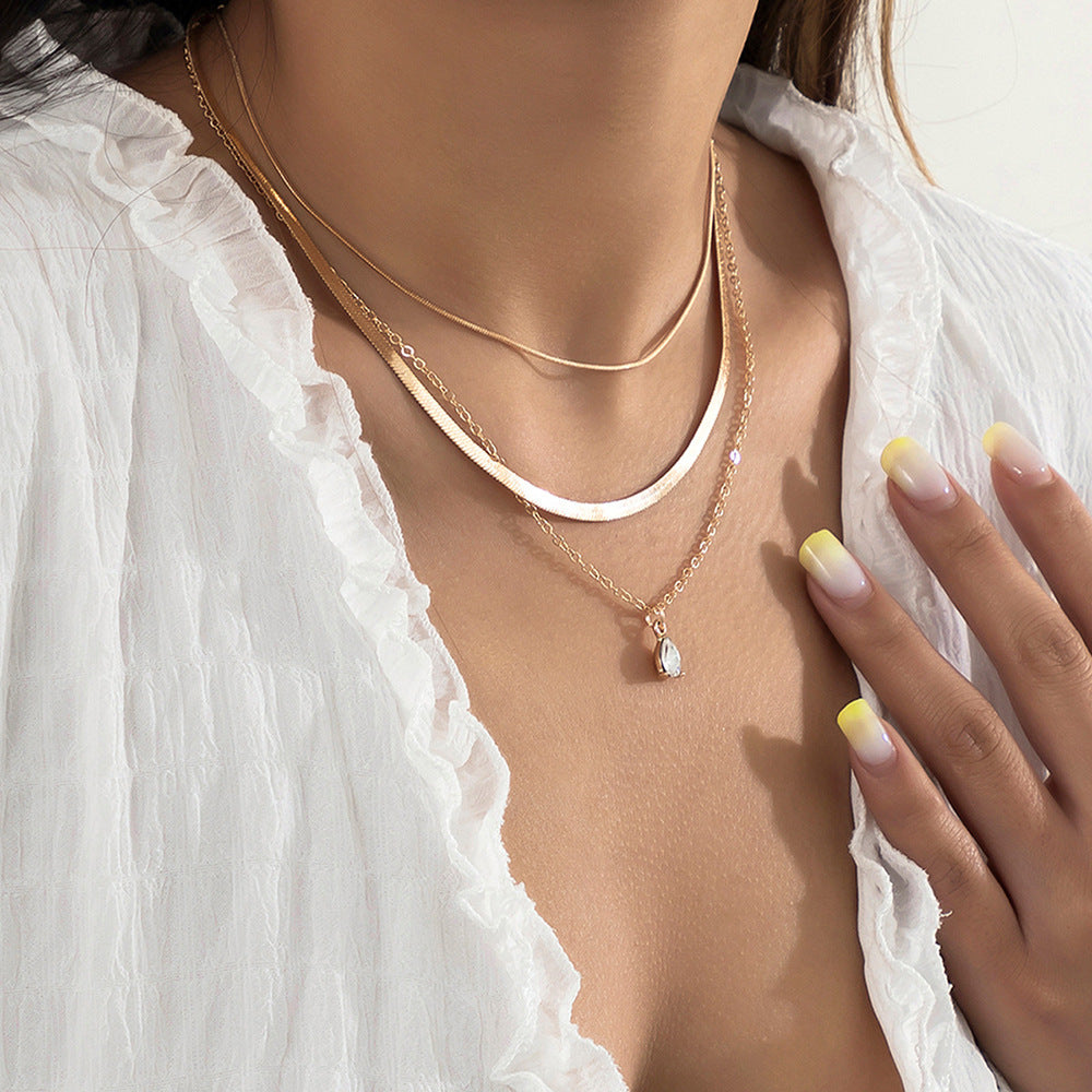 Layered Lotus Pendant Necklace with Geometric Blade Chain
